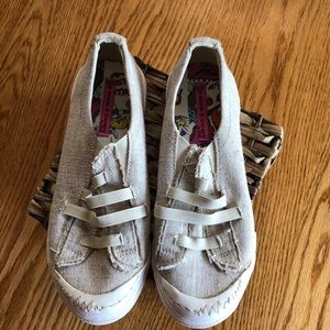 Rock & Candy by Zigi women’s polo on sneakers